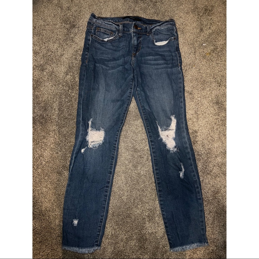 Francesca’s Blue Washed Jeans with rips.